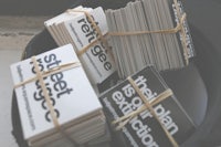 a stack of business cards in a hat